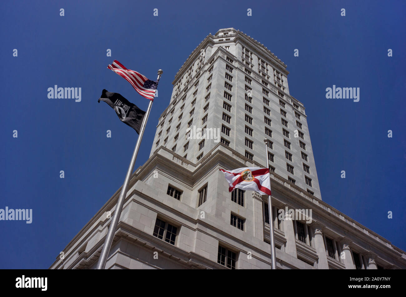 Historic Miami-Dade County Courthouse building in downtown Miami. The black flag in the picture is POW/MIA flag Stock Photo