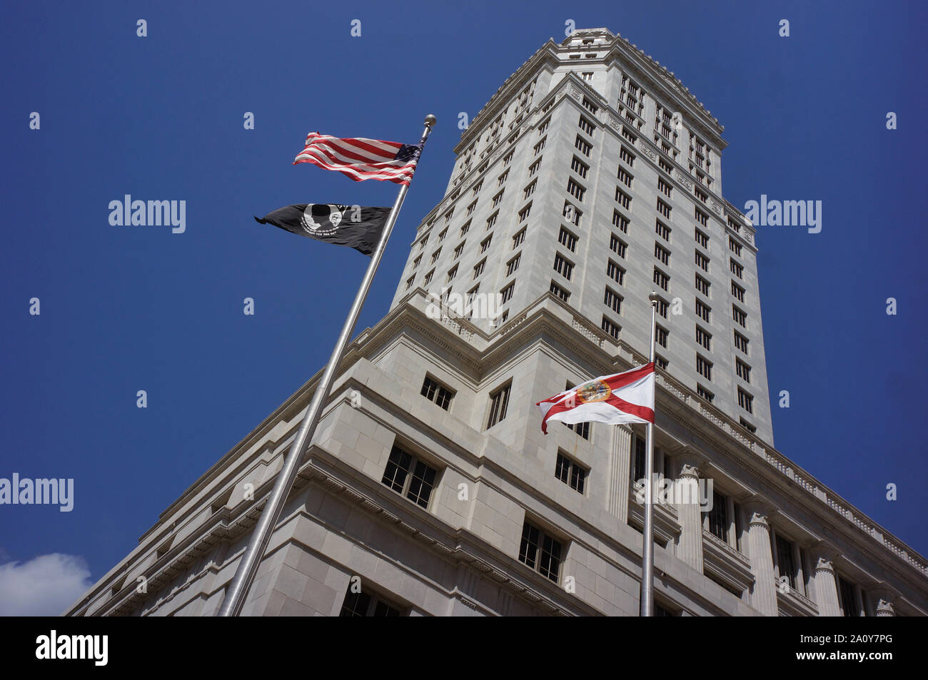 Historic Miami-Dade County Courthouse building in downtown Miami. The black flag in the picture is POW/MIA flag Stock Photo