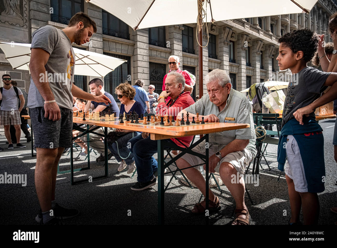 Gerard Ayats, national sub 18 chess champion plays a simultaneous exhibition game during the World Day without Cars holiday.Barcelona celebrates World Day without a Car by conditioning one of the main arteries of the city for the use of citizens with different cultural recreational activities. Thousands of citizens have enjoyed a festive day on Via Laietana with the circulation completely closed to vehicles. Stock Photo