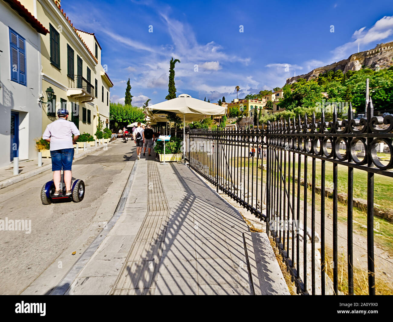 Tourists on segways,  two-wheeled, personal transporters, in Monastiraki area outside of Roman forum in Athens, Greece. Stock Photo