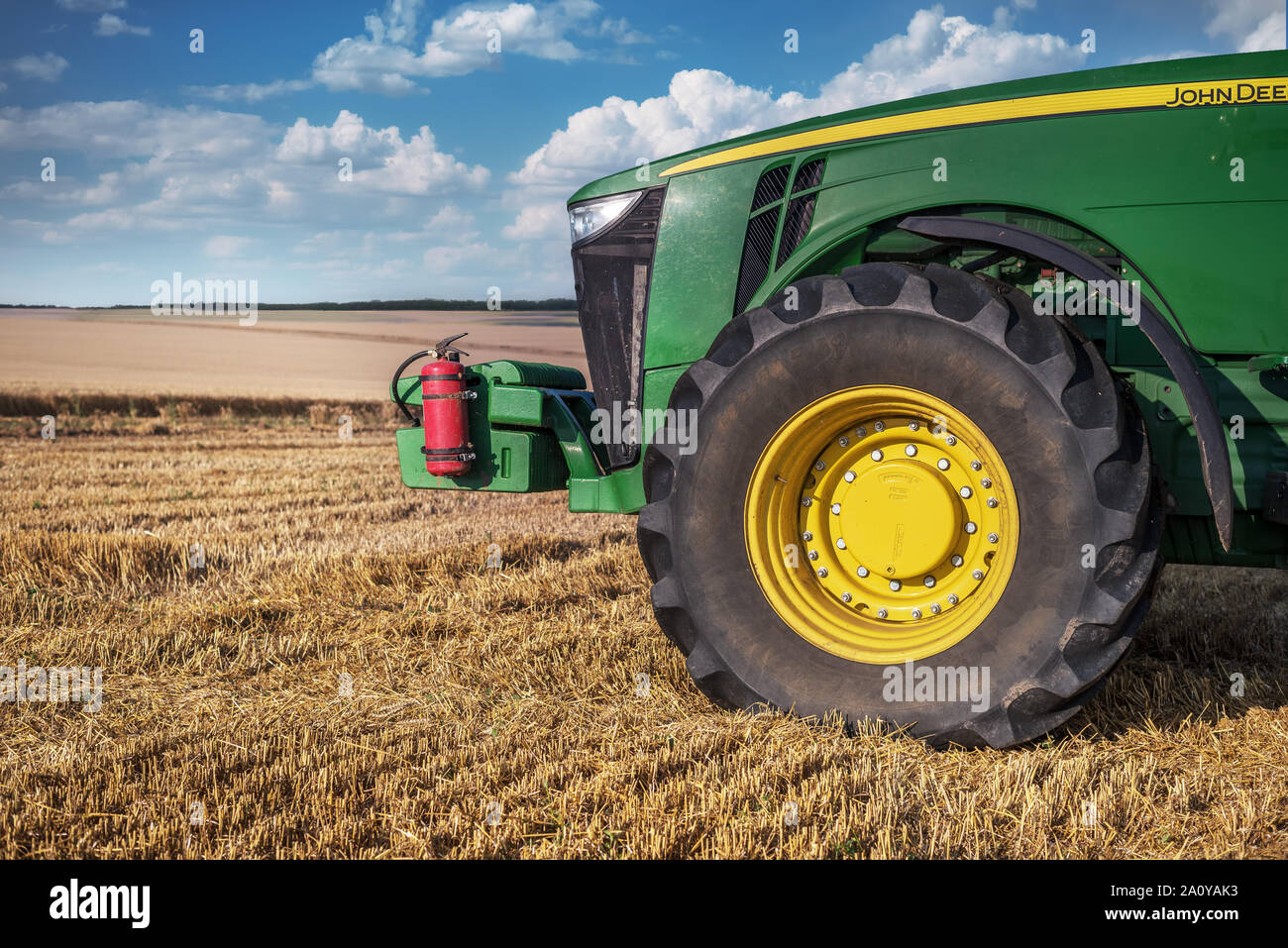 Agronomy concept. Wheat field a tractor. Stock Photo