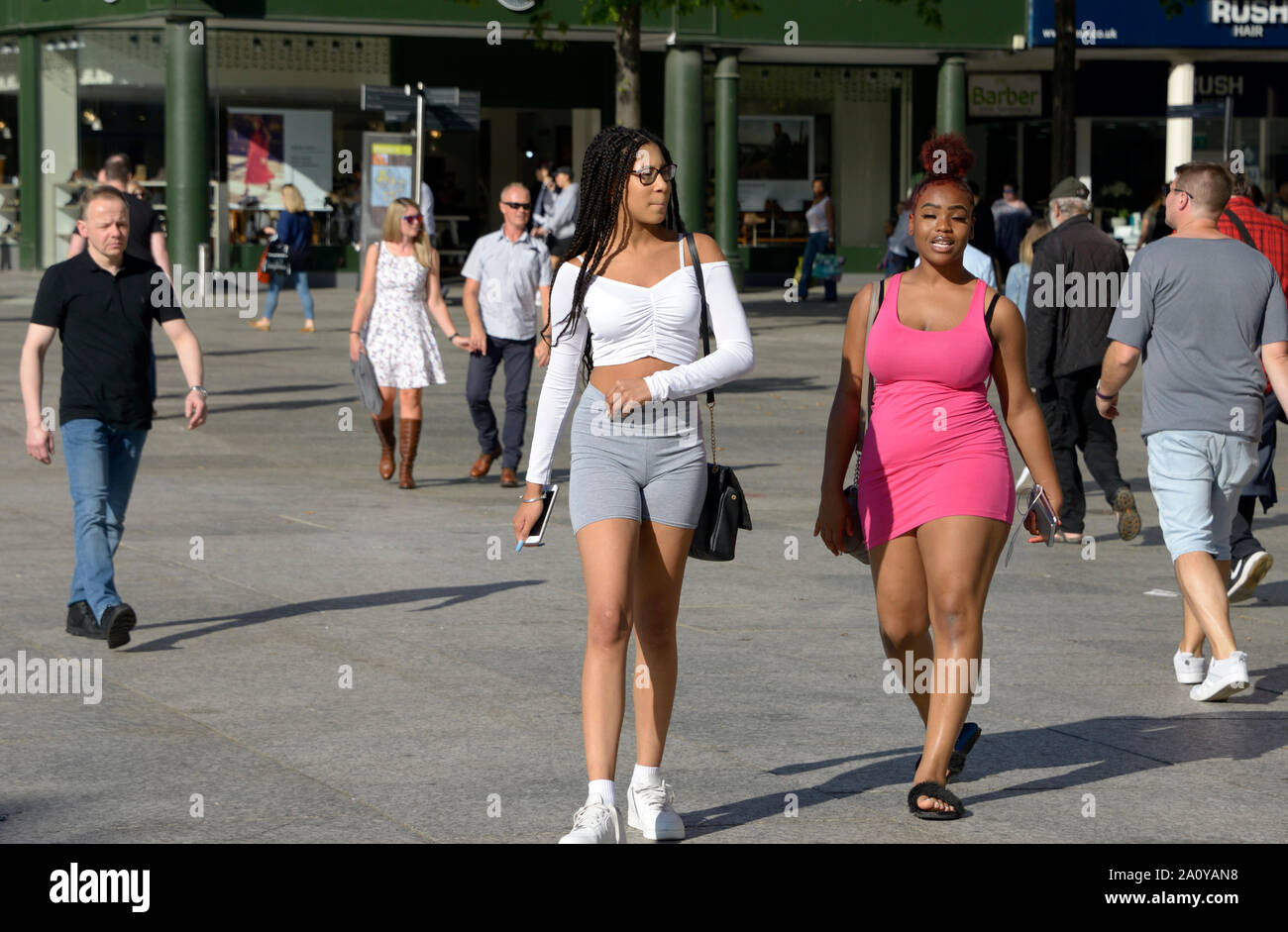 Two girls, out in the sun. One mixed race. Stock Photo