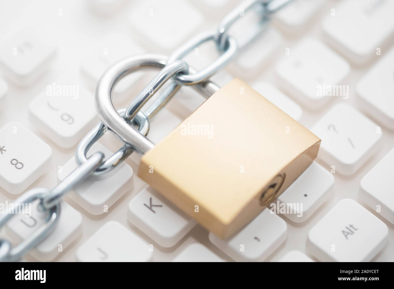 Security concept with metal padlock and chain on computer keyboard Stock Photo