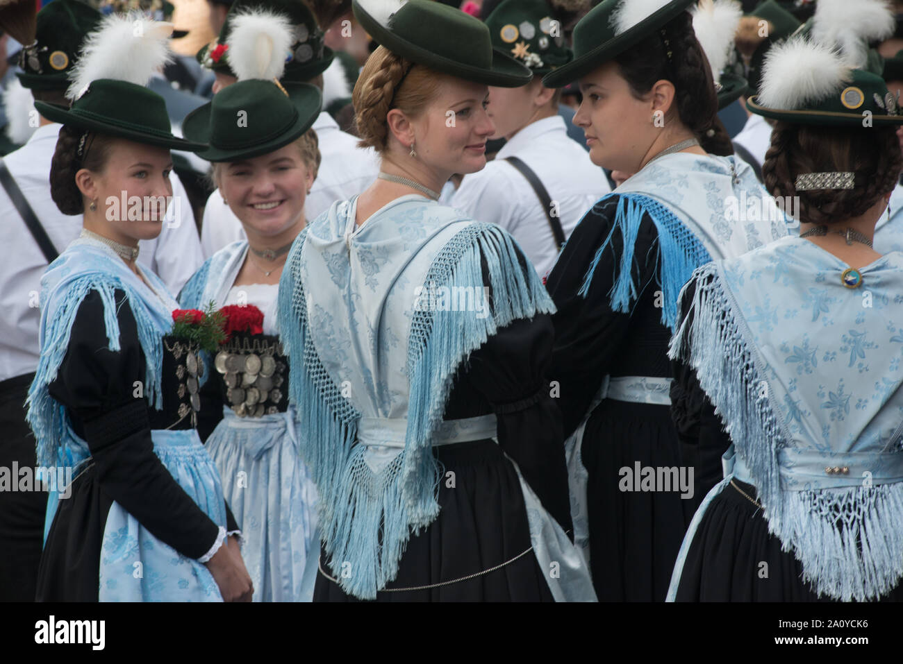 young women in Bavarian traditional costumes, seen before the costume parade on the occasion of Oktoberfest in Munich Stock Photo