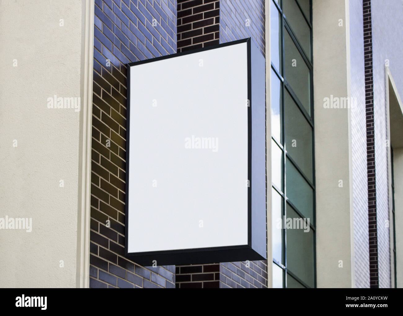 Blank white outdoor box with black frame mockup wall mounted Stock Photo