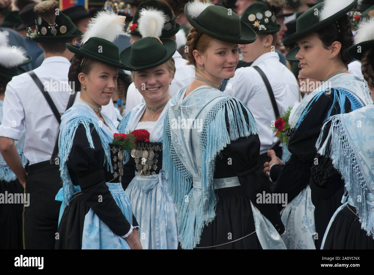 young women in Bavarian traditional costumes, seen before the costume parade on the occasion of Oktoberfest in Munich Stock Photo