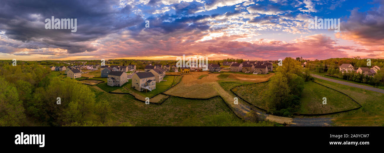 Aerial view of luxury houses in a Maryland upper middle class neighborhood American real estate development in the USA with stunning sunset color sky Stock Photo