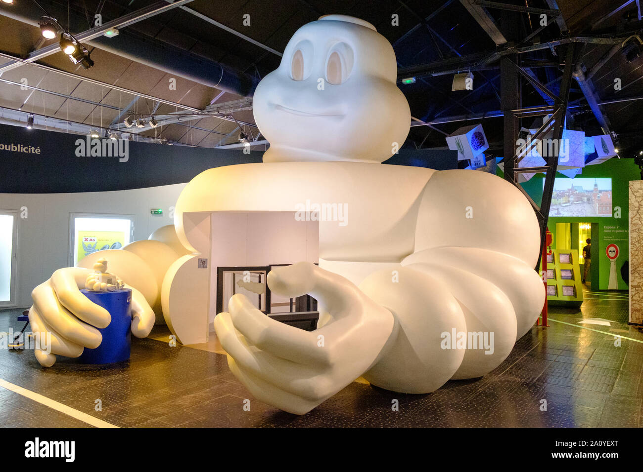 Huge Michelin Tyre Man (bibendum) forming entrance to first floor of L'Aventure Michelin museum in Clermont Ferrand, France Stock Photo