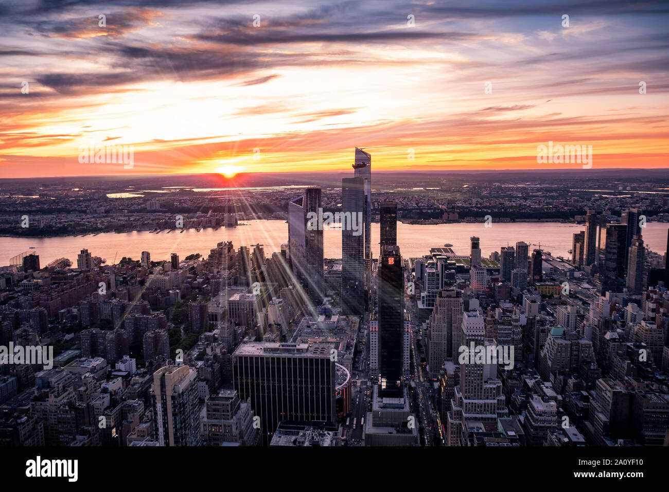View across New York City at midtown Manhattan and the Hudson river at sunset from the Empire State Building Stock Photo