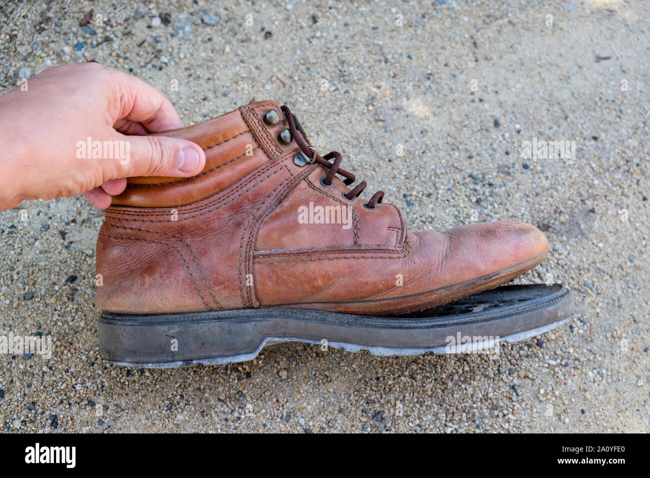 Old walking boot with separating sole Stock Photo Alamy
