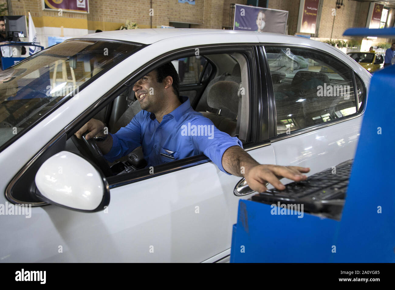 Tehran, Iran. 22nd Sep, 2019. Employees of Seraj vehicle Technical  Inspection Center check cars in the