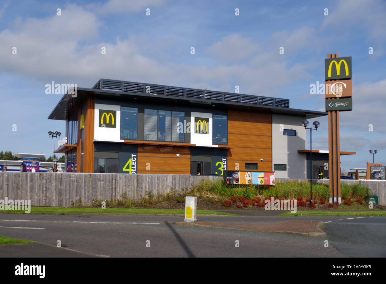 McDonald's Fast Food outlet, with the famous Golden Arches logo. Serves mostly burgers and chips. Drumchapel, Glasgow, Scotland Stock Photo