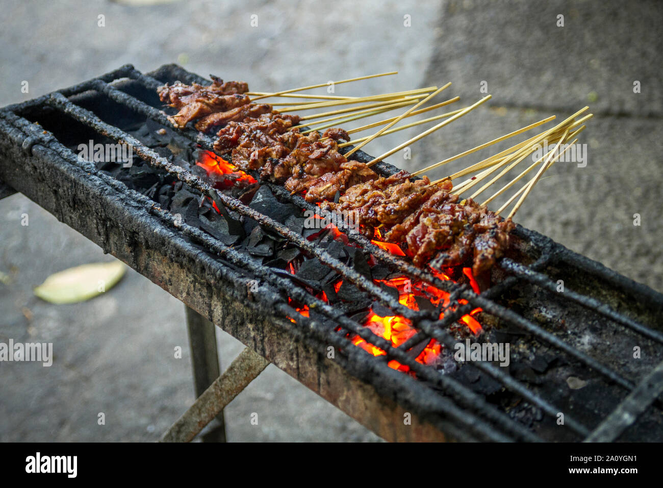 Chicken satay grill at a busy street food market Stock Photo Alamy