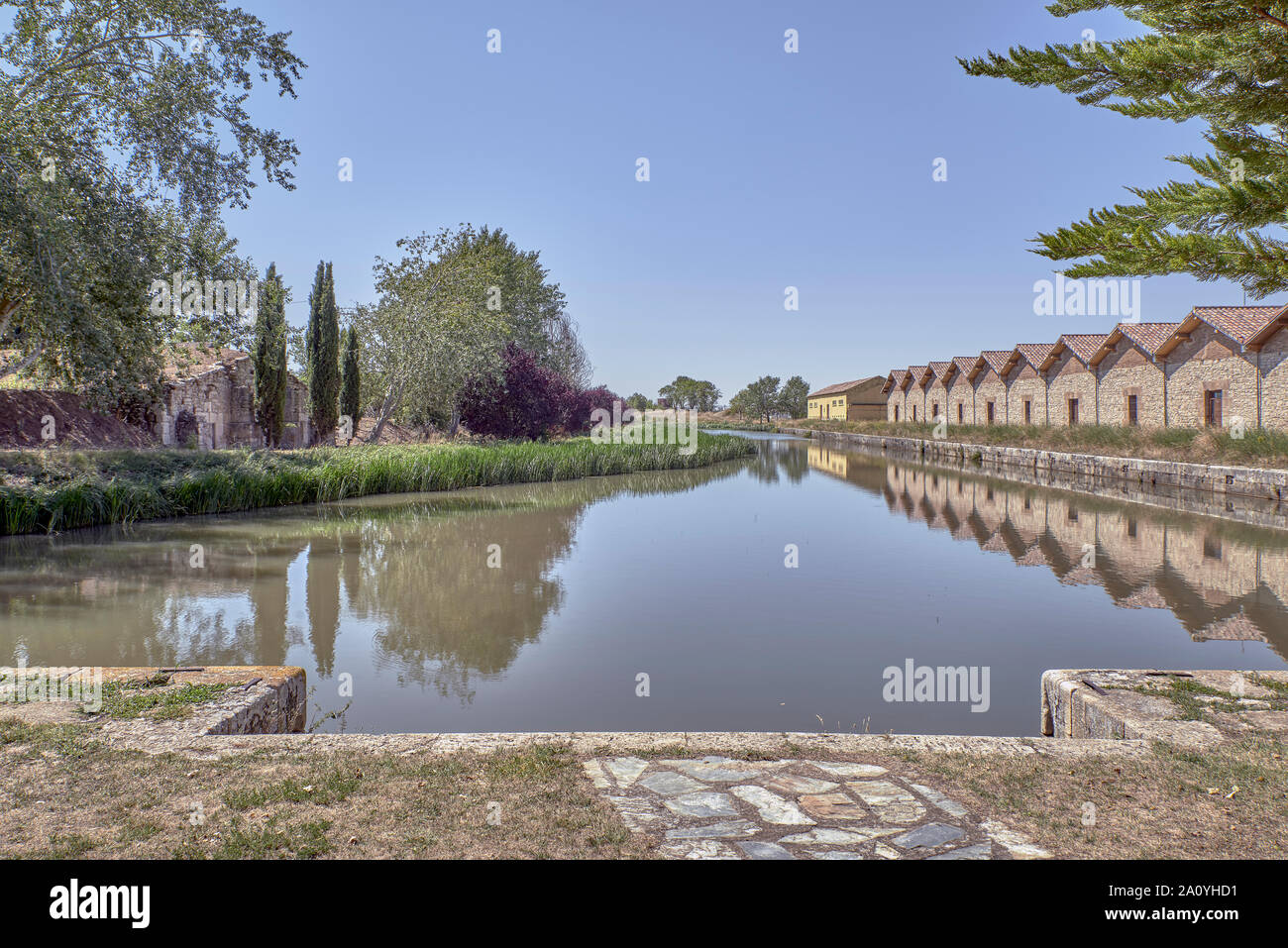 Northern branch of the Castilla Canal, river port and restored warehouses on the pier of Alar del Rey, Palencia, Castile and Leon, Spain, Europe Stock Photo