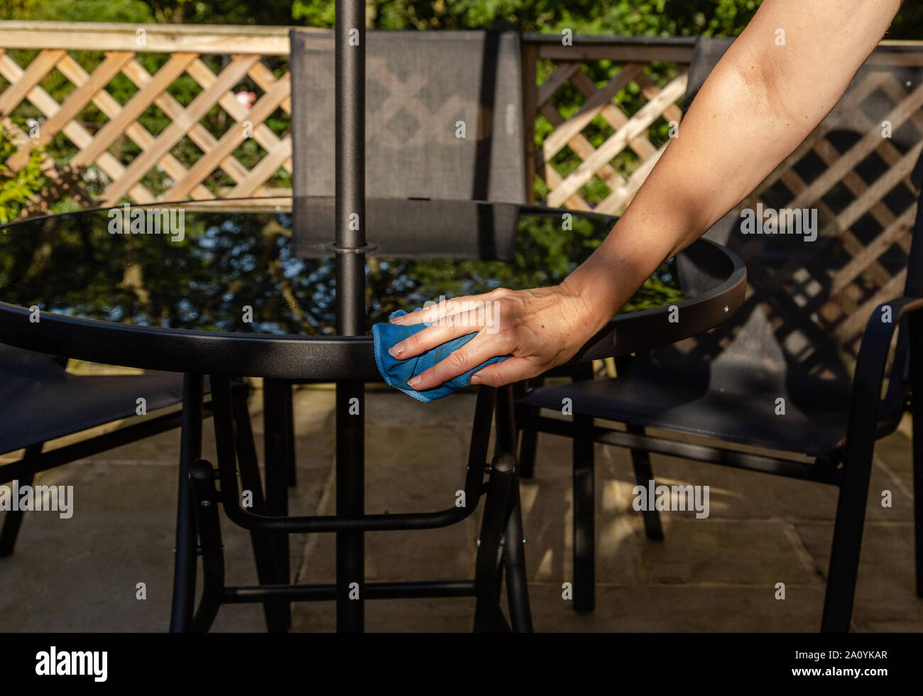 Cleaning garden furniture Stock Photo Alamy