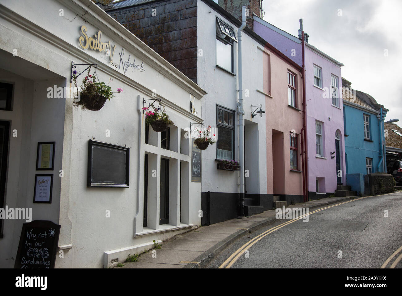 houses at the top of the High street in Salcombe, freshly painted small cottages in Salcombe, Devon Stock Photo