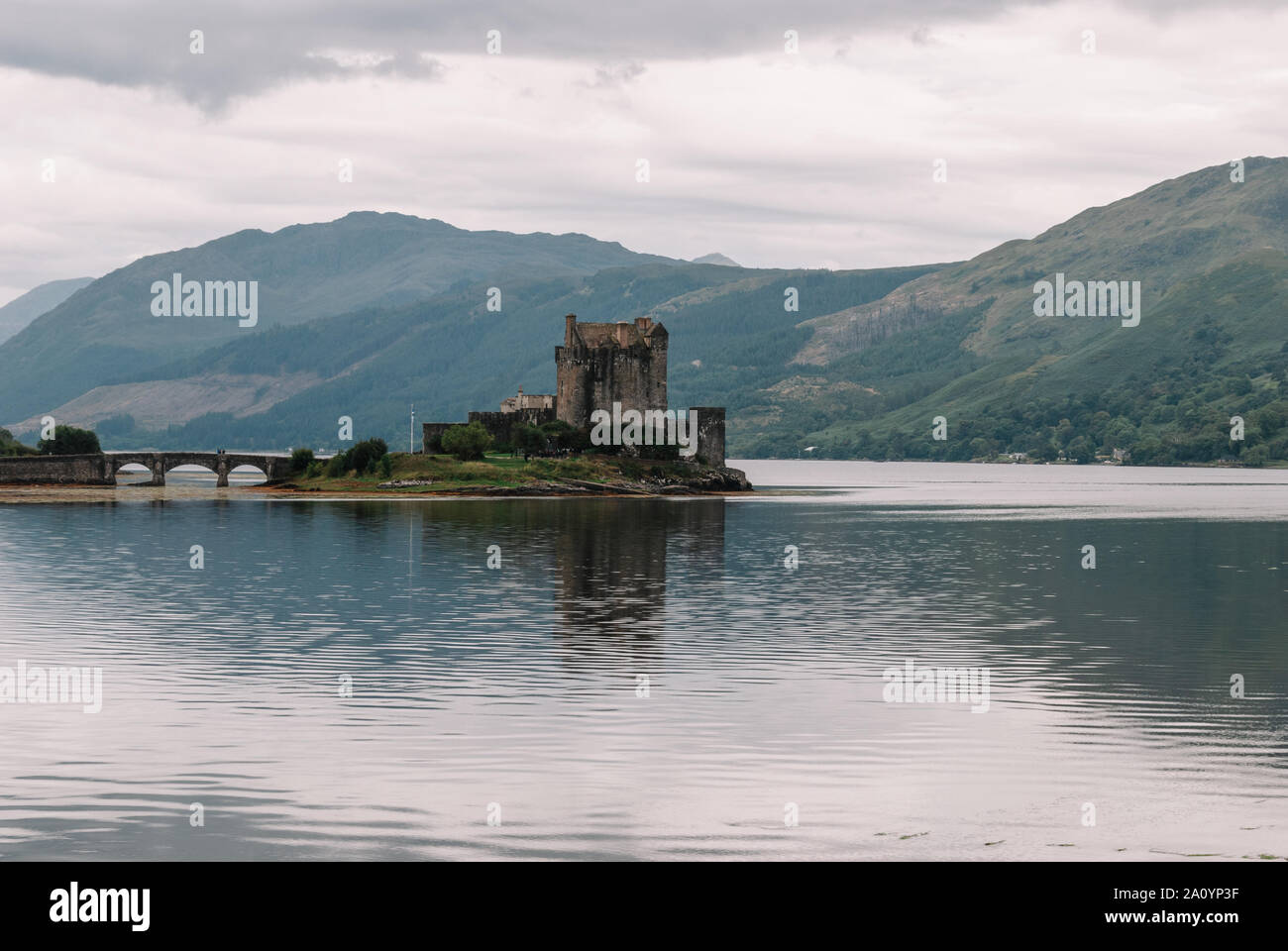 Dornie, Scotland; August 27th 2019: Eilean Donan Castle and its reflection over the lake Stock Photo