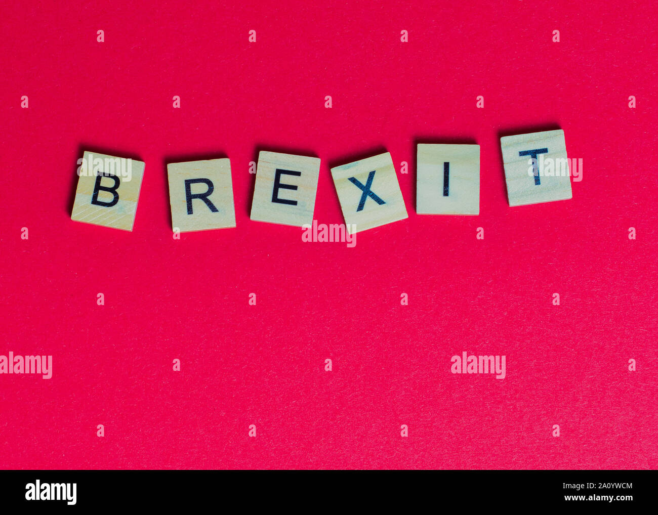 word Brexit laid with wooden letters on a red background Stock Photo