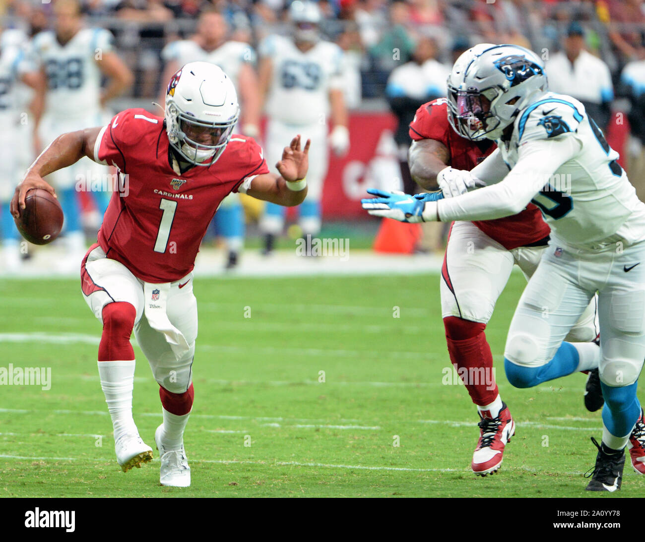 Arizona Cardinals' quarterback Kyler Murray (L) tries to dodge a tackle by Carolina Panthers' Marquis Haynes in the second quarter at State Farm Stadium in Glendale, Arizona on Sunday, September 22, 2019. Photo by Art Foxall/UPI Stock Photo