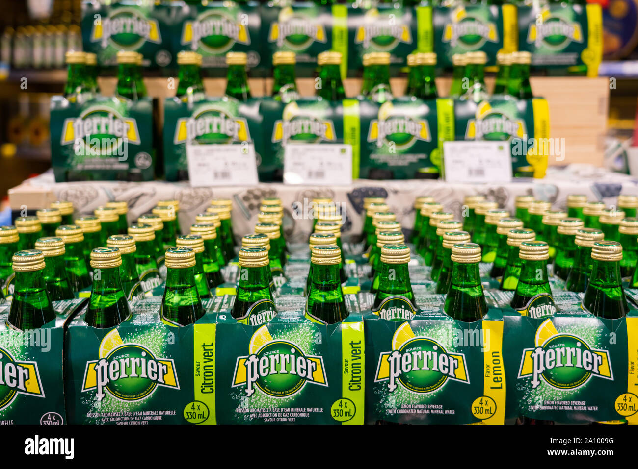 French natural bottled mineral water, Perrier at a supermarket in Shanghai. Stock Photo