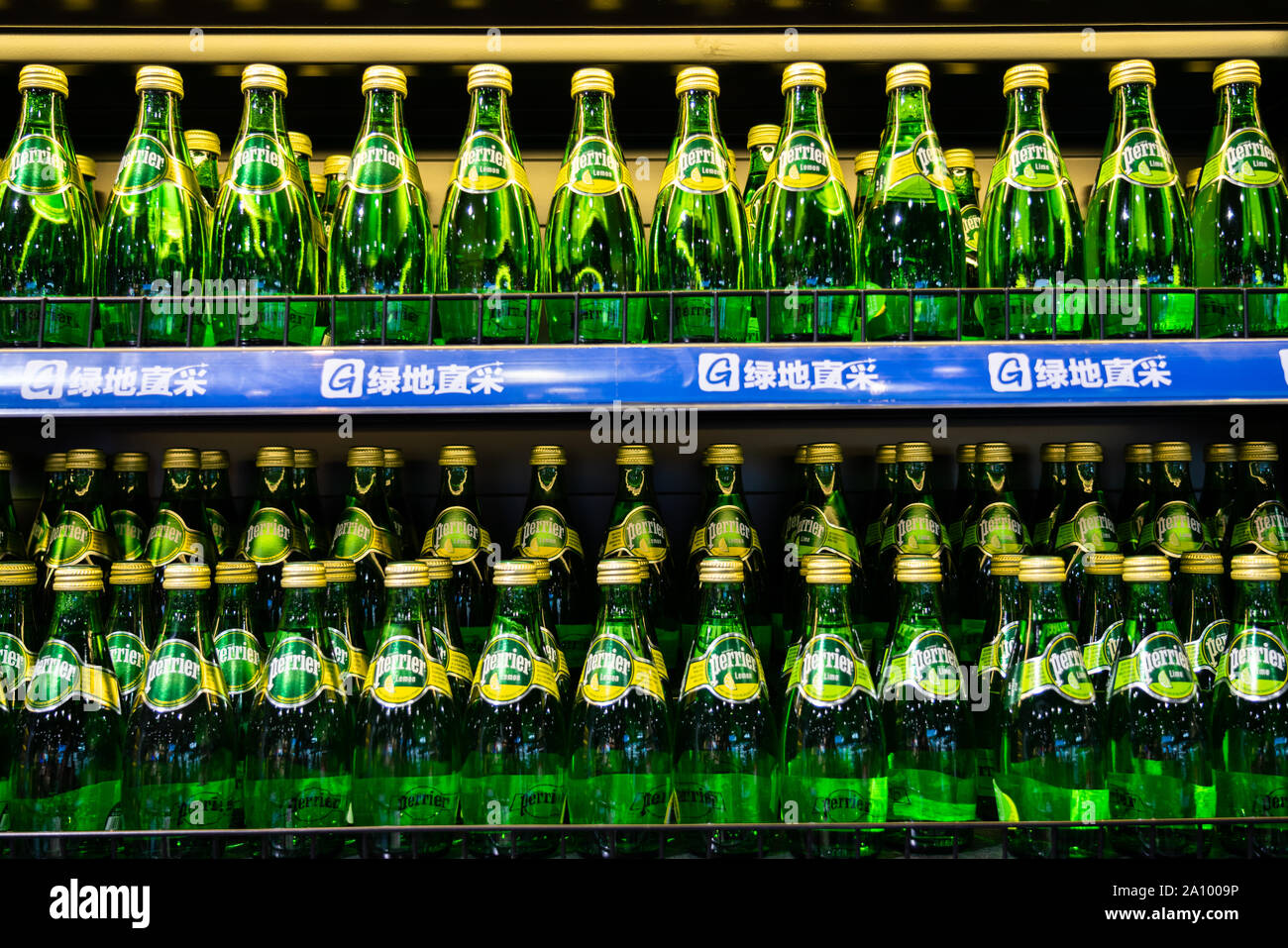 French natural bottled mineral water, Perrier at a supermarket in Shanghai. Stock Photo