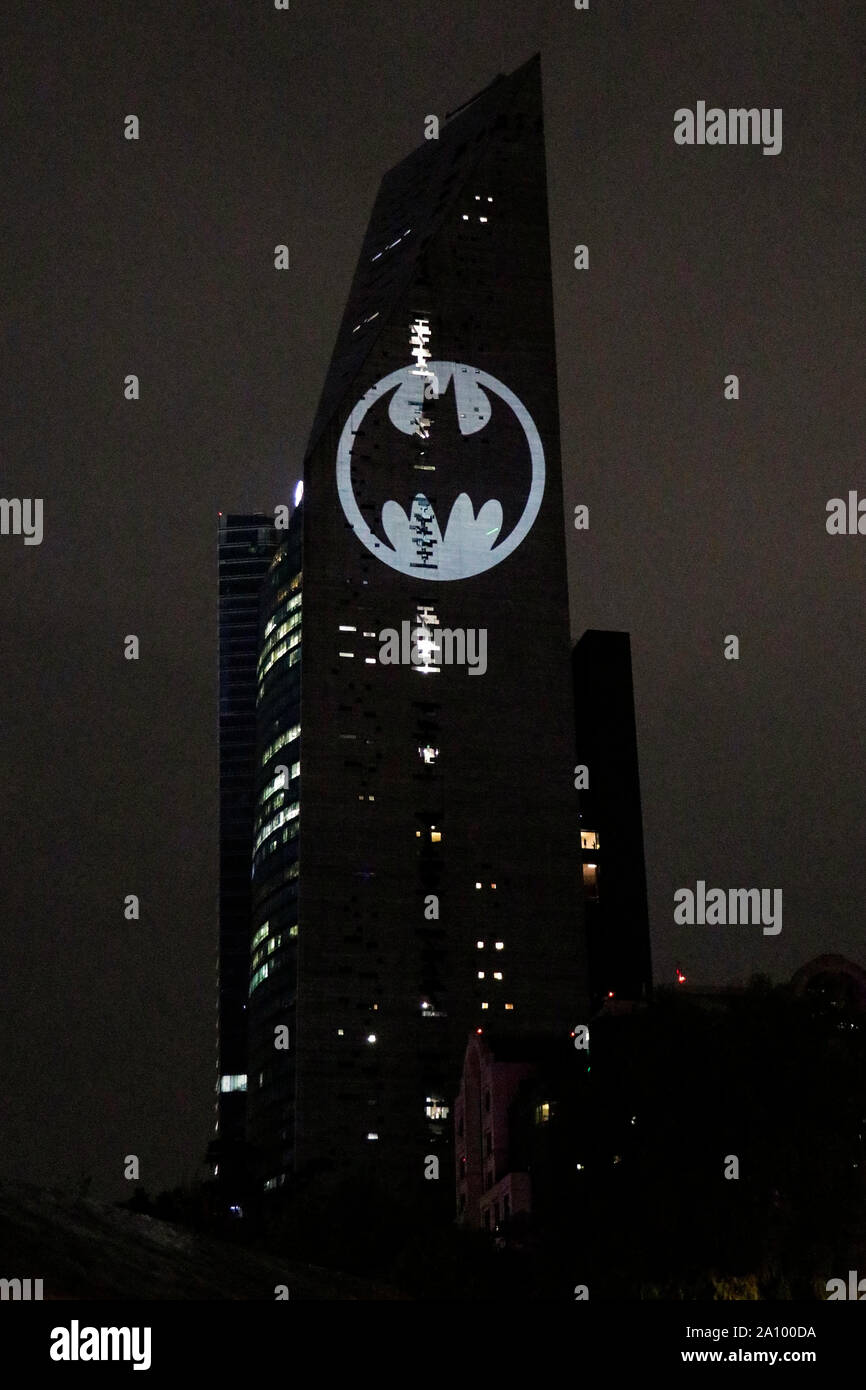 View of the Batman's symbol projected on the Reforma Tower, fans celebrated the 80th birthday of their comic hero worldwide, Mexico City, on September 21, 2019.  Francisco Morales/DAMMPHOTO Stock Photo