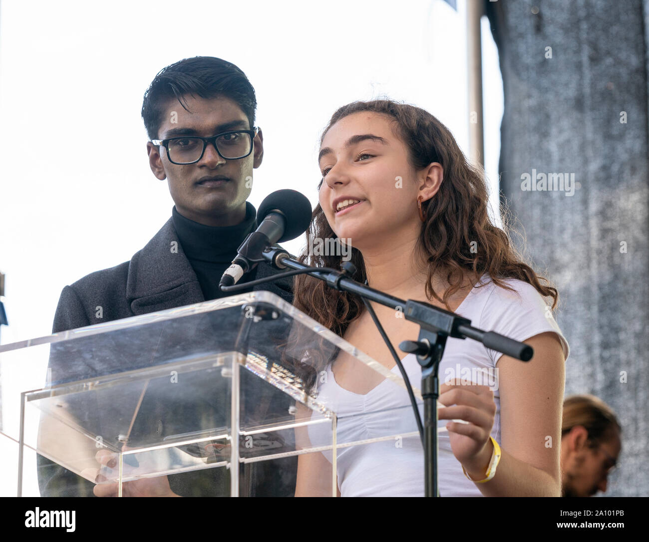 New York, United States. 20th Sep, 2019. Activists Kevin Patel and Isabella Fallahi speak on stage during NYC Climate Strike rally and demonstration at Battery Park. Credit: SOPA Images Limited/Alamy Live News Stock Photo