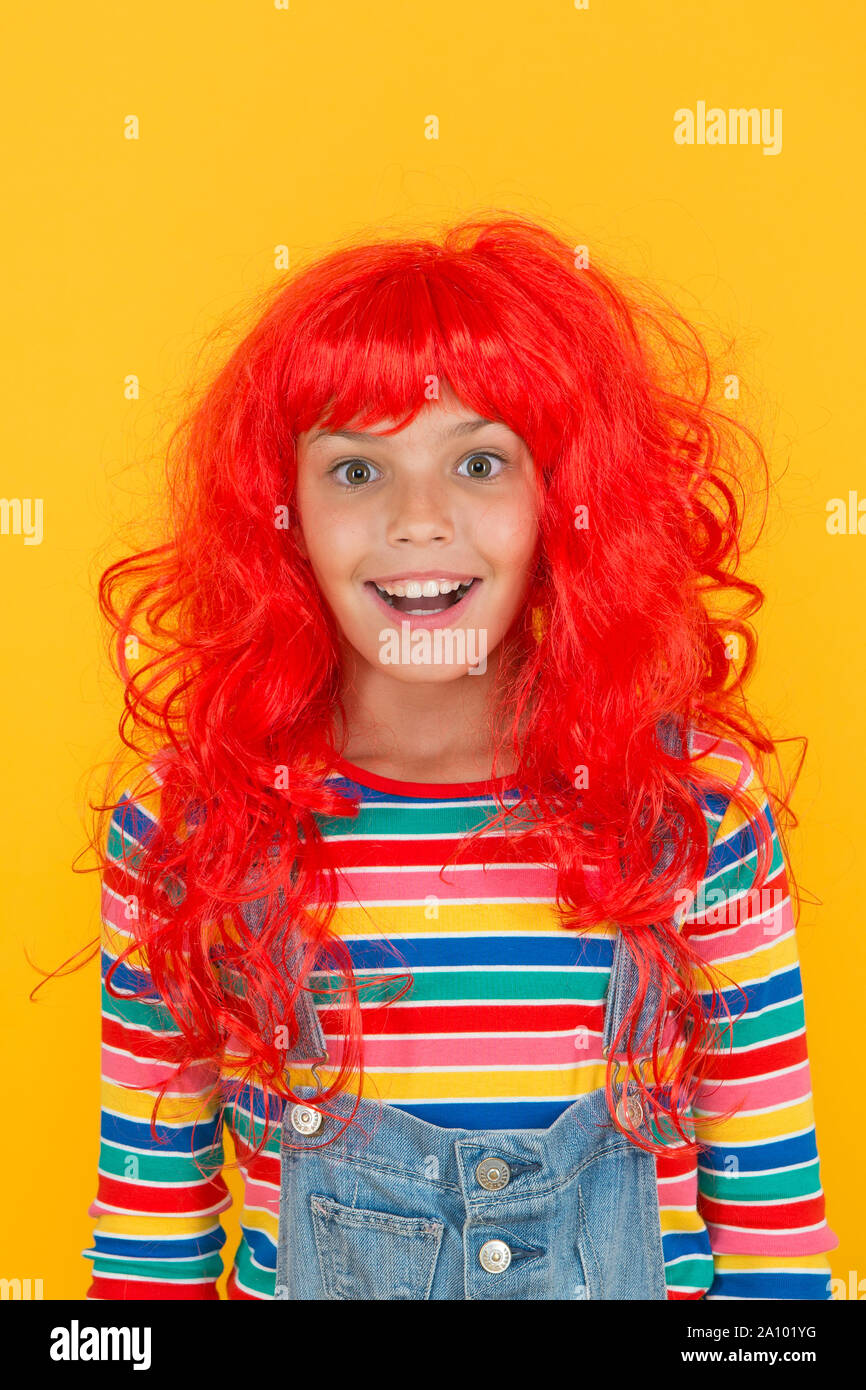 Messy hairstyle. Kid cheerful smiling happy redhead girl. I am ginger and proud of it. Redhead stereotypes. Redheads are not some creatures with magical soul sucking powers. Crazy redhead wig. Stock Photo