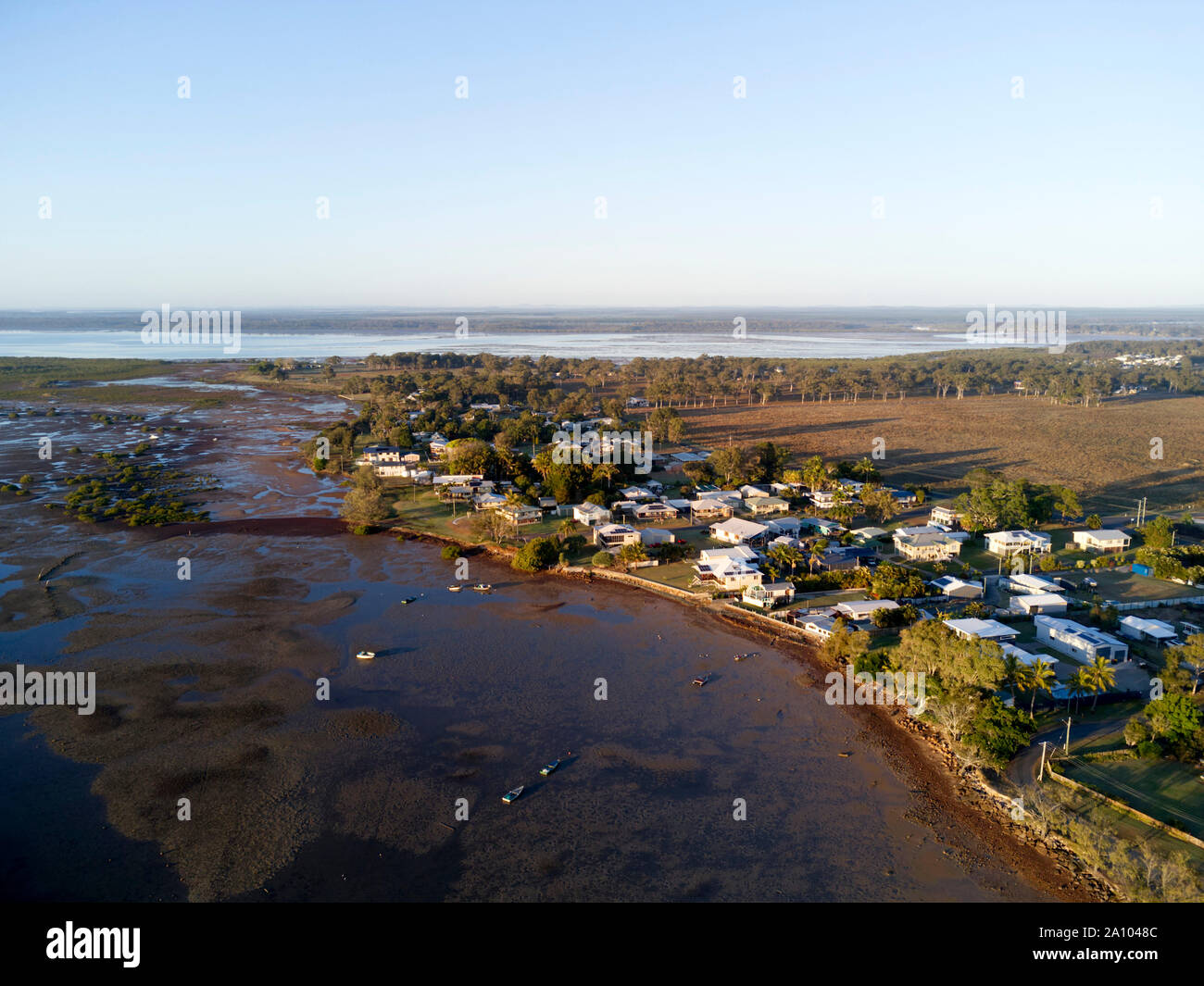 Early morning aerial of the coastal village of Boonooroo on the shores of the Great Sandy Strait