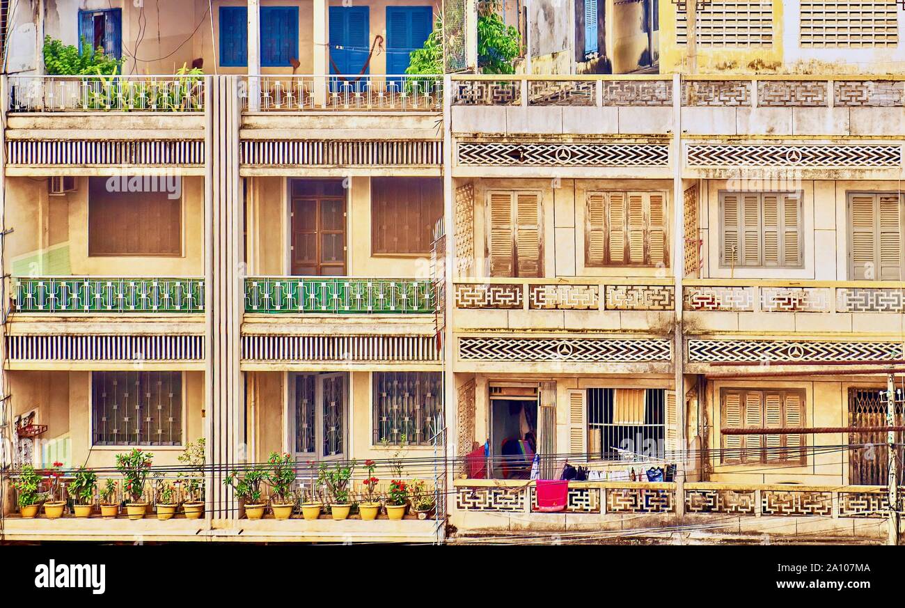 Two neighboring Cambodian apartment building facades, including