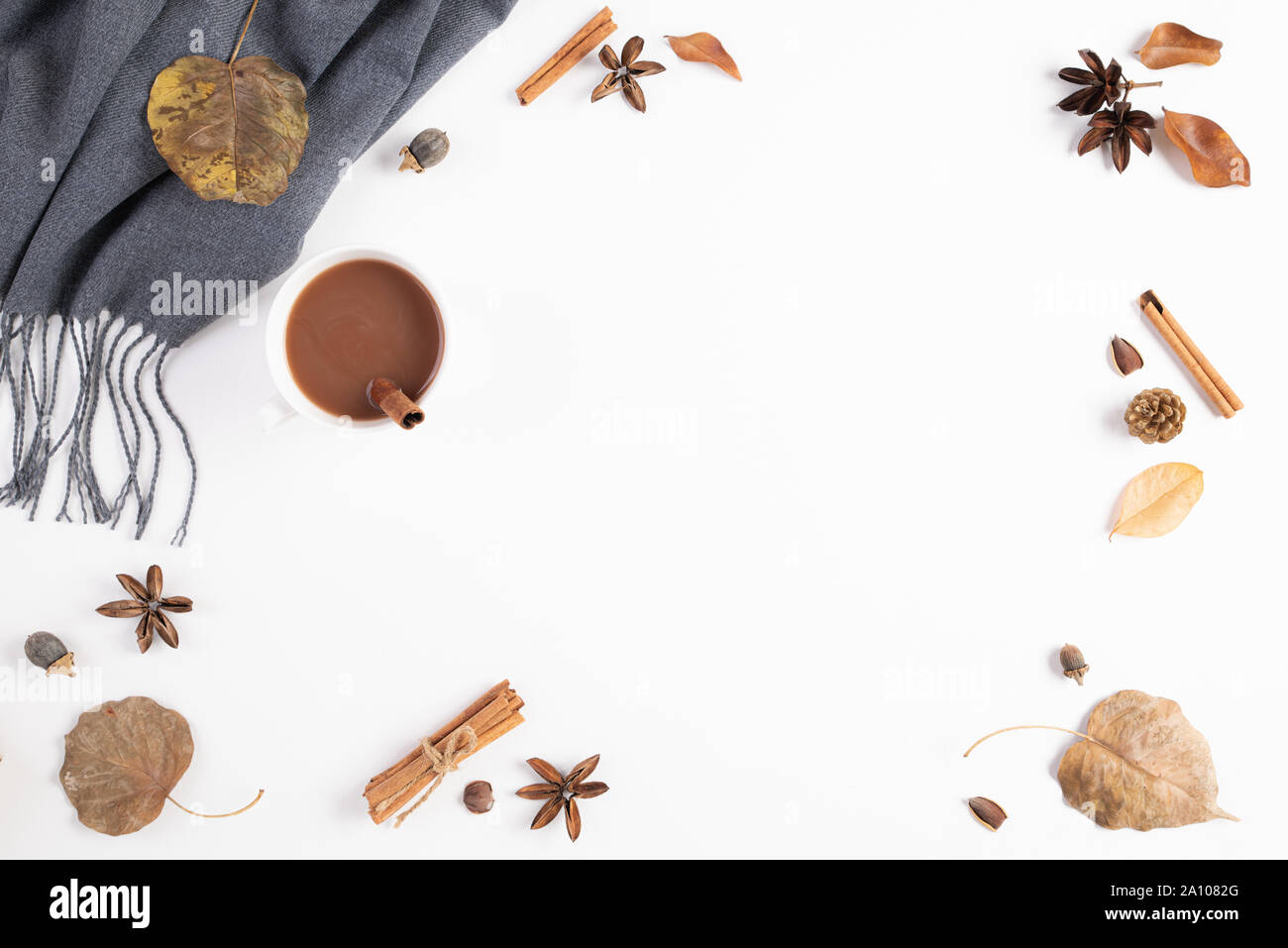 Autumn composition. Cup of coffee, blanket, autumn leaves on white background. Flat lay, top view copy space. Stock Photo