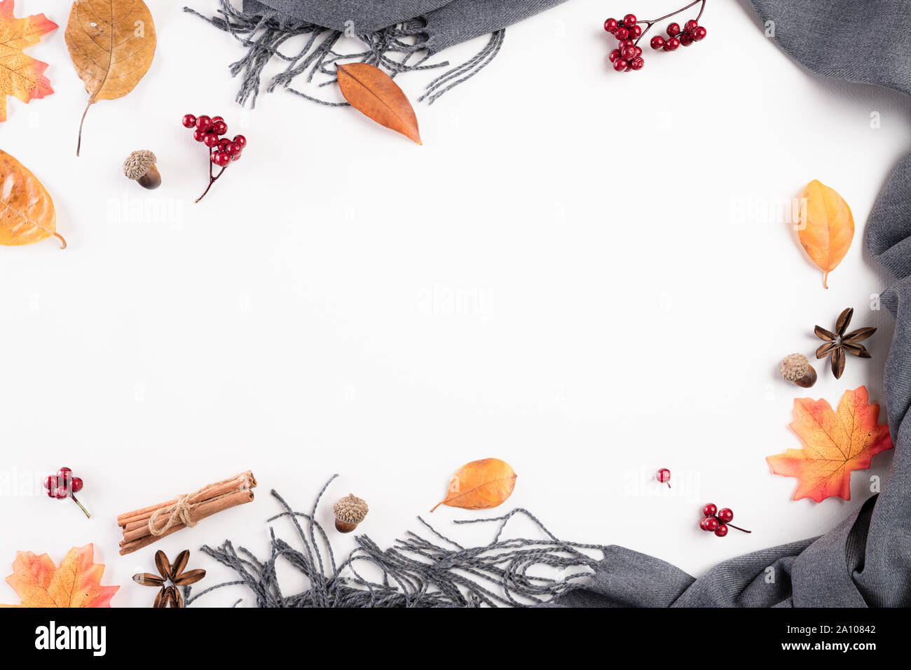Autumn composition. blanket, autumn leaves on white background. Flat lay, top view copy space. Stock Photo