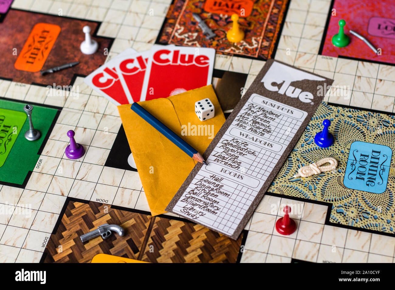 Clue 1972 (Second Edition) - The board with checklist, tokens, die, pencil, cards and checklist all ready to play the game Stock Photo