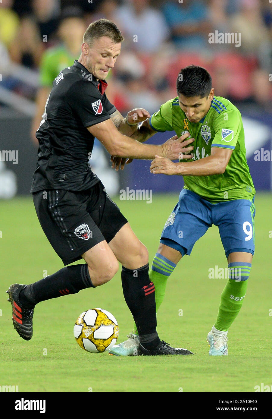 Washington, DC, USA. 22nd Sep, 2019. 20190922 - D.C. United midfielder FREDERIC BRILLANT (13), left, ties up Seattle Sounders forward RAUL RUIDIAZ (9) in the second half at Audi Field in Washington. Credit: Chuck Myers/ZUMA Wire/Alamy Live News Stock Photo