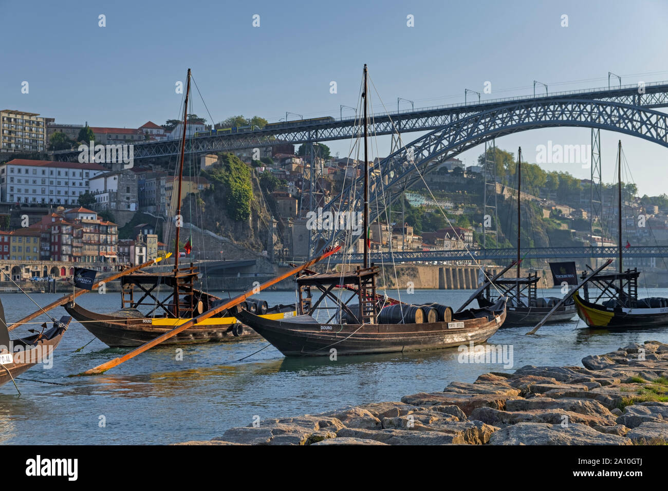 Port boats and Dom Luis I Bridge Douro River Porto Portugal Stock Photo