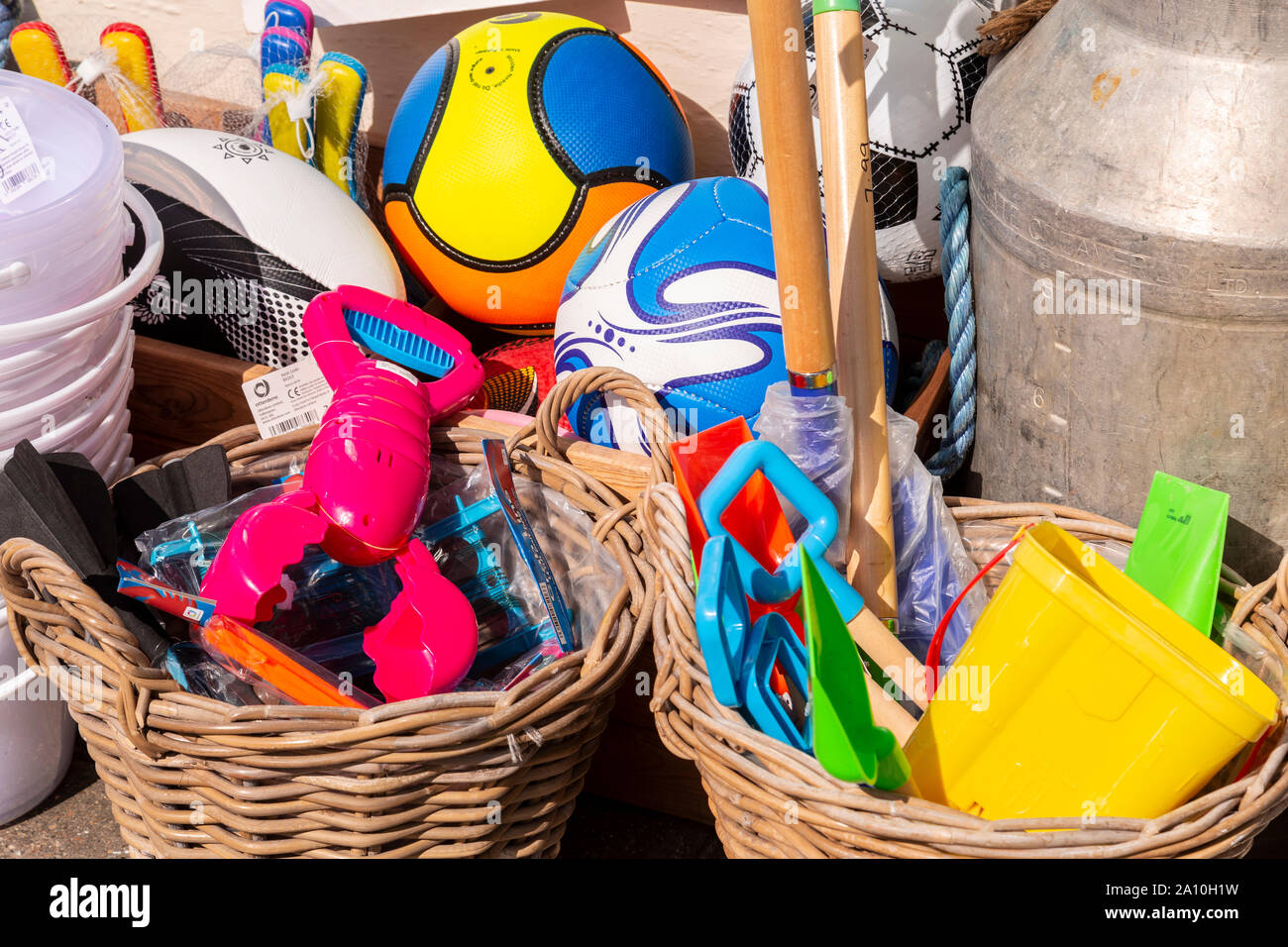 Colourful plastic beach toys for sale at Port Isaac, Cornwall, Enlgand Stock Photo