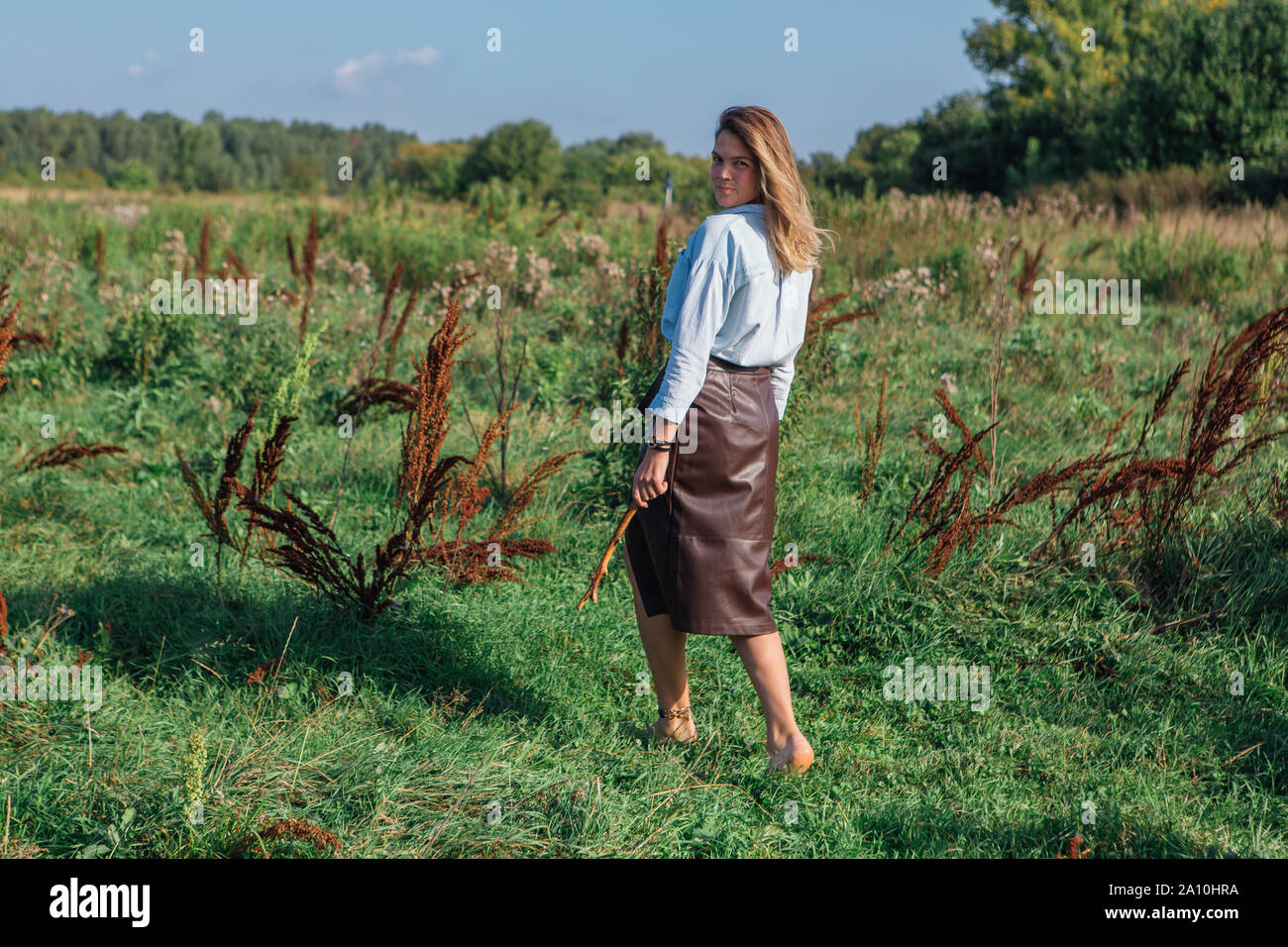 Boho woman walking away hi-res stock photography and images - Alamy
