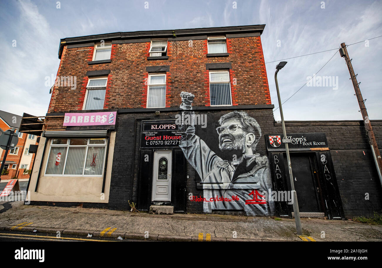 Liverpool FC manager Jurgen Klopp features on the side of a barber shop in Liverpool. The streets of the city have been transformed with bursts of colour as artists make their mark. Stock Photo