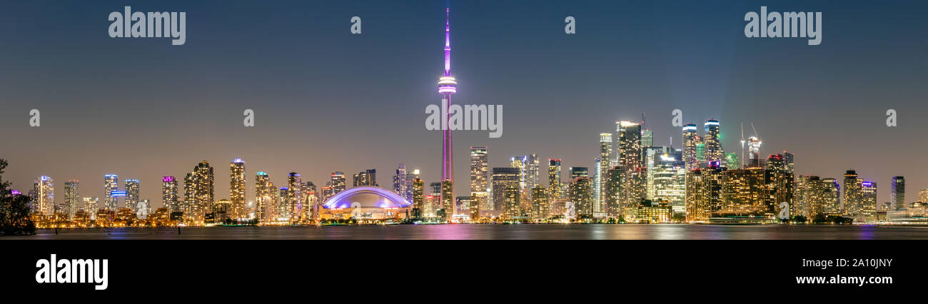 An extremely wide and high detail composite long exposure panorama of the downtown Toronto skyline at night as seen from the Toronto Islands. Stock Photo