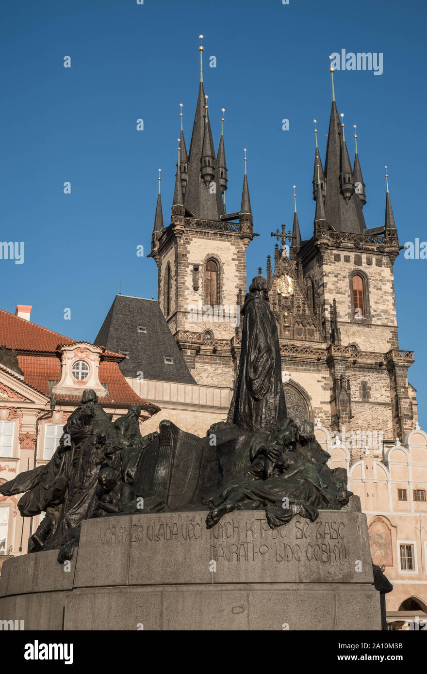 Jan Hus memorial and exterior gothic towers of Church of our Lady before Tyn, Old Town Square, Stare Mesto, Prague, Czech Republic Stock Photo