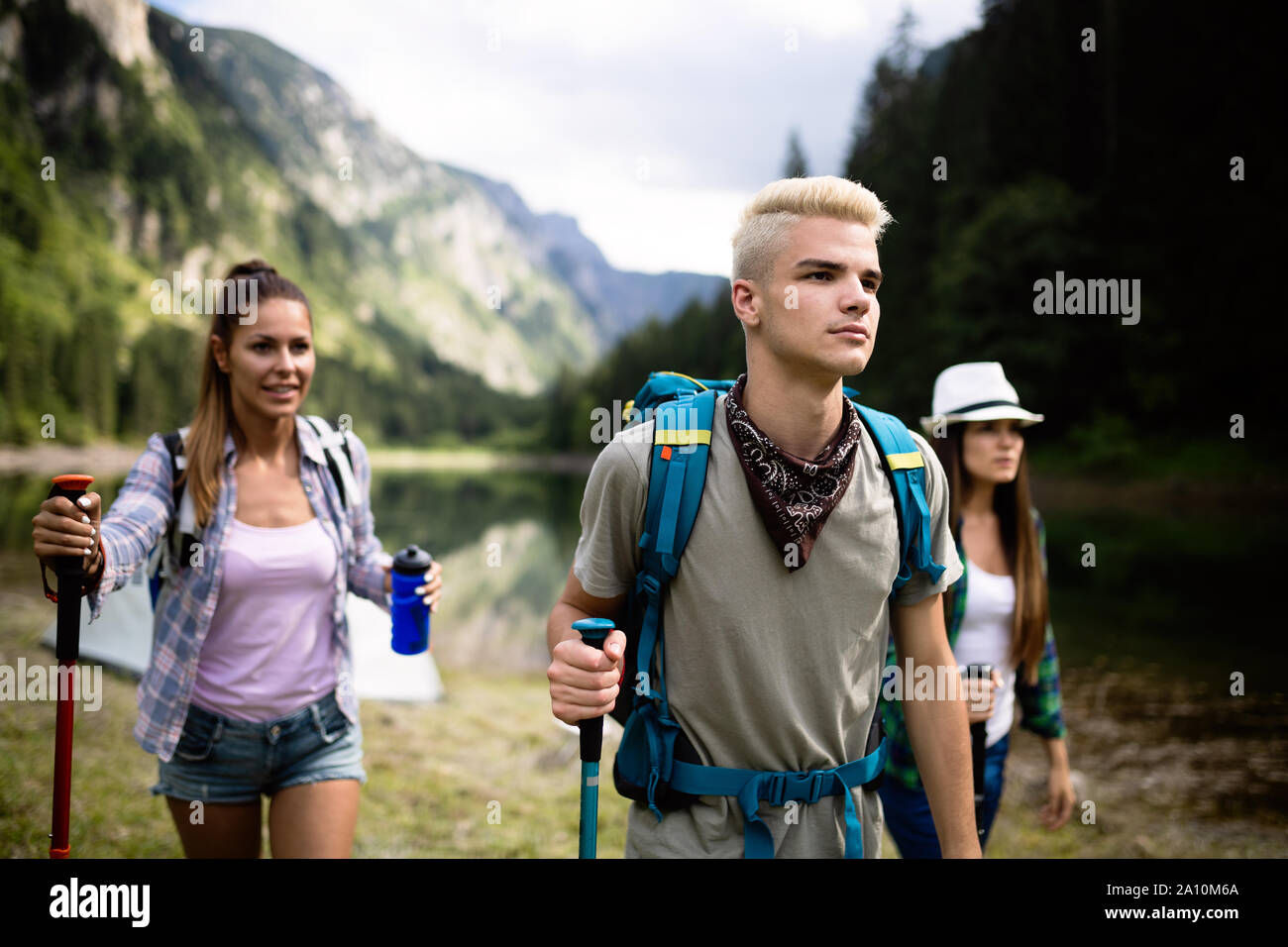 Group of happy young people friends hiking together outdoor Stock Photo ...