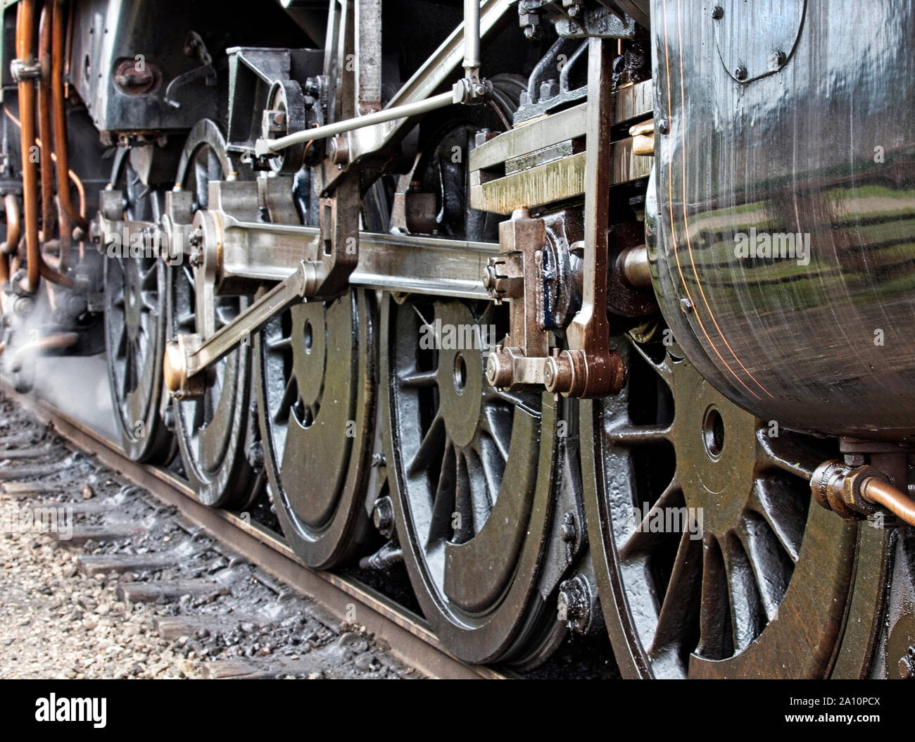 Set of driving wheels on a restored steam locomotive. Stock Photo