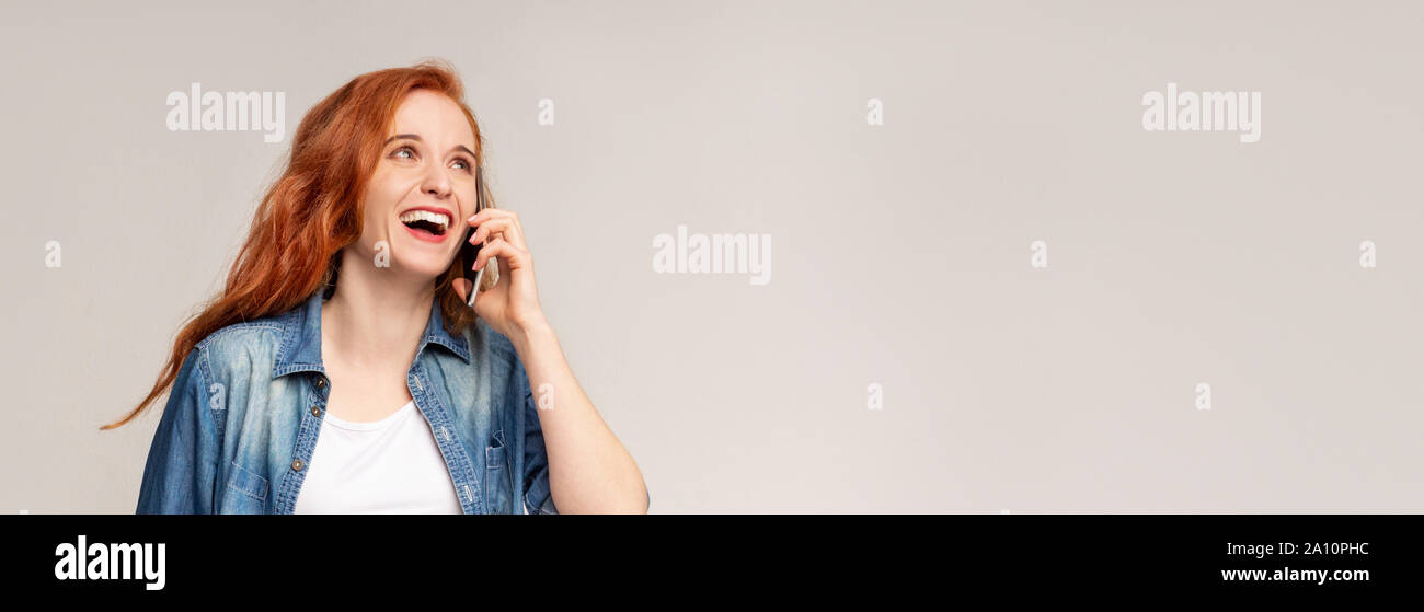 Positive millennial girl talking on mobile phone, got good news Stock ...