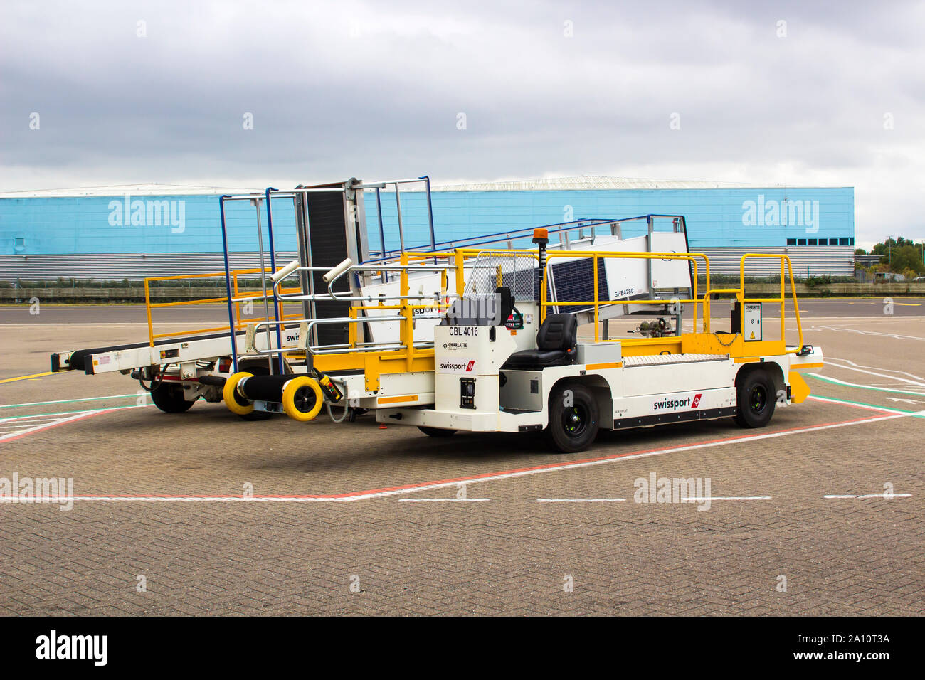 16 September 2019 Various baggage handling vehicles and loaders parked up in the early evening at Southampton Airport England Stock Photo
