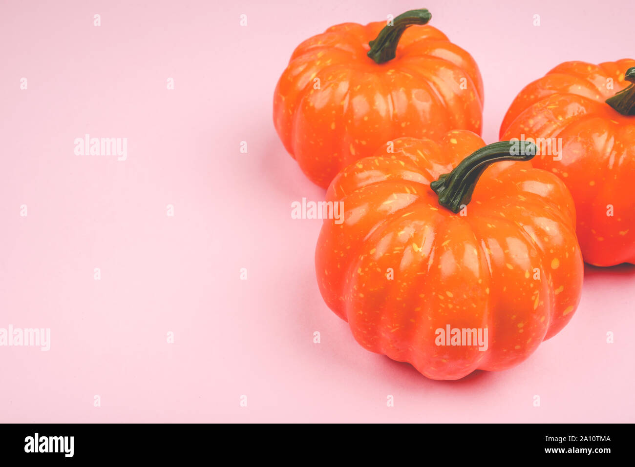 Pink background with pumpkins Stock Photo - Alamy