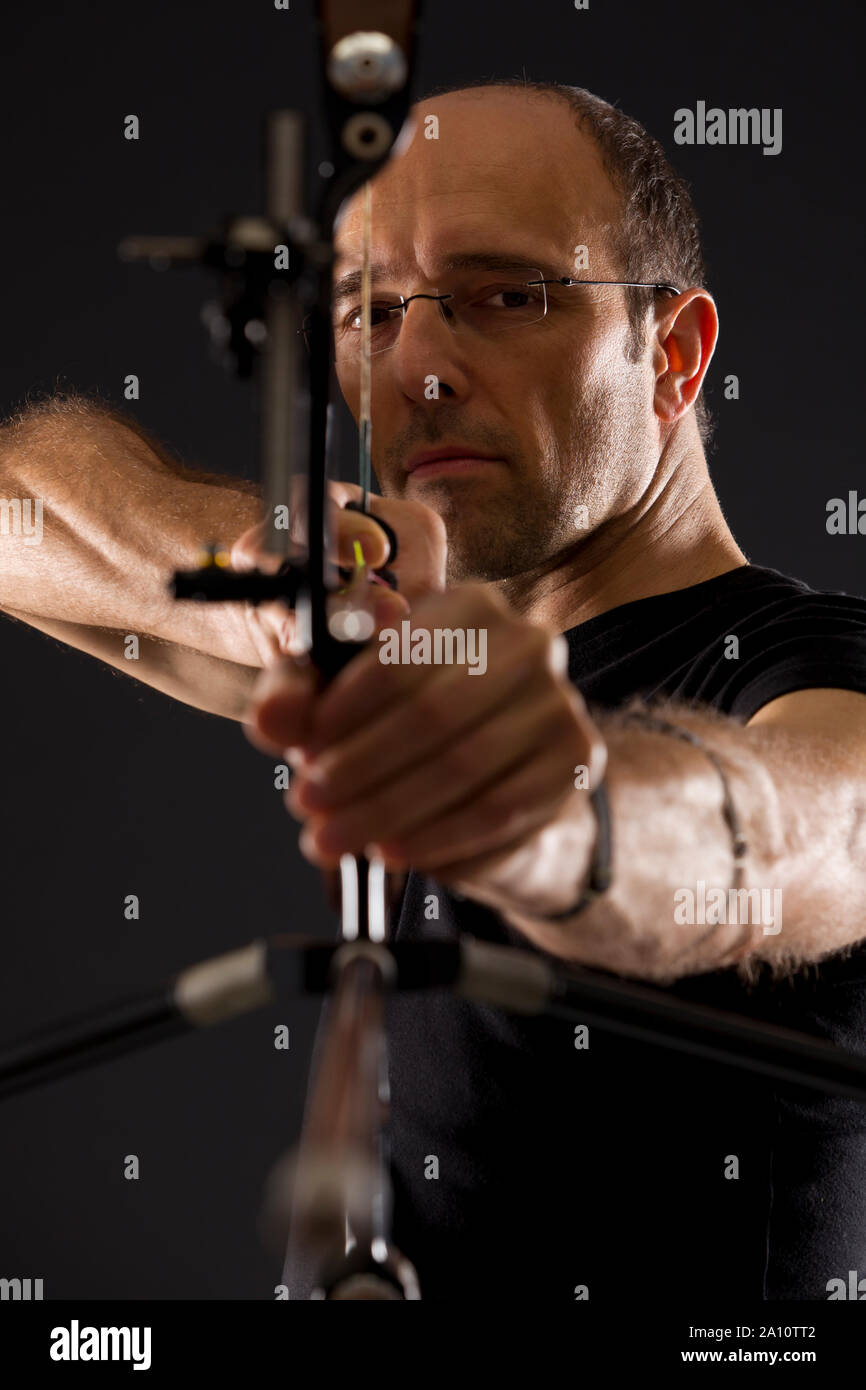 Front view of archer with bow and arrow. Stock Photo