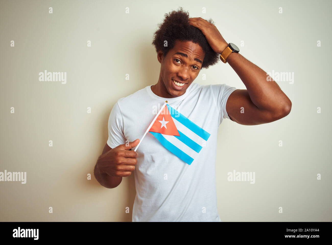 Young african american man holding Cuba Cuban flag standing over ...