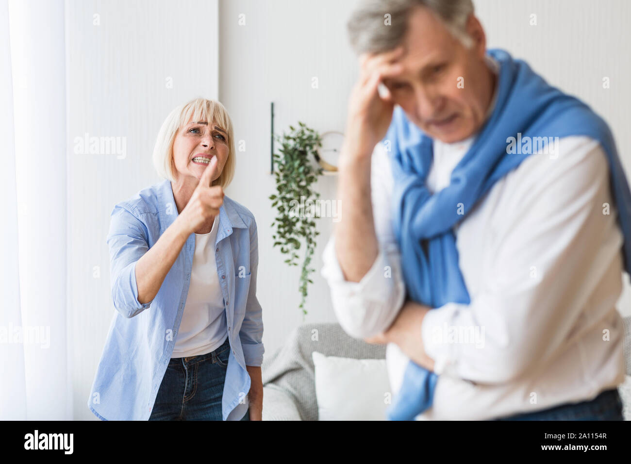 Senior couple having relationship problems, quarrelling at home Stock Photo