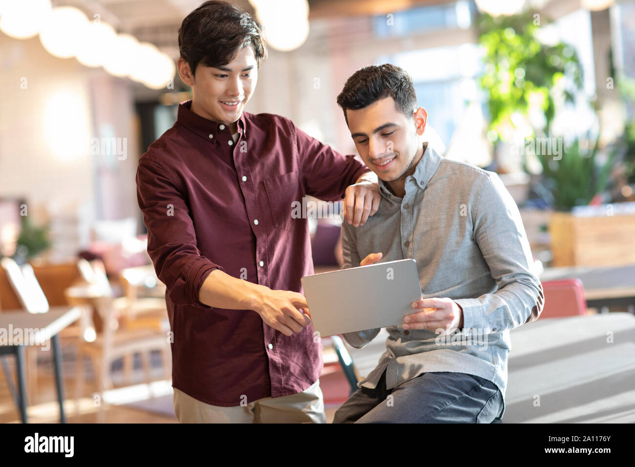 Young abroad students using digital tablet Stock Photo