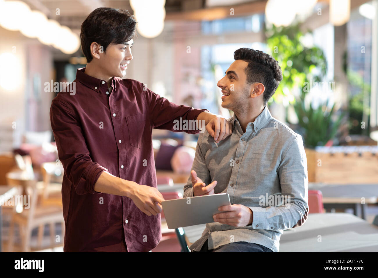 Young abroad students using digital tablet Stock Photo